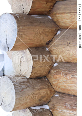 Fragment of a log cabin. Corner joint of the logs. 136133651