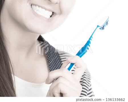 Woman brushing cleaning teeth. 136133662