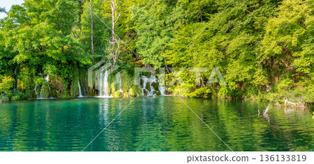 Plitvice lakes, Croatia. View of beautiful lakes, waterfalls and forest at national nature park. Plitvice lakes, Croatia. View of beautiful lakes, waterfalls and forest at national nature park. 136133819