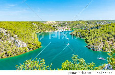 Higway over the Krka river, Croatia. View from famous bridge near the Sibenik and Skradin city. River with boat and yacht. 136133857