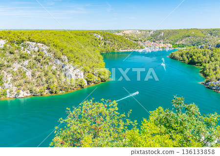 Higway over the Krka river, Croatia. View from famous bridge near the Sibenik and Skradin city. River with boat and yacht. 136133858