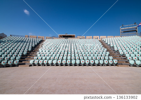 Stage inside of Michaels Fortress in Sibenik, Croatia. Red dots on seats are measures against the COVID disease. Stage inside of Michaels Fortress in Sibenik, Croatia. Red dots on seats are measures against the COVID disease. 136133902
