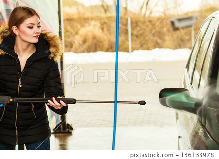 Woman washing car on open air 136133978