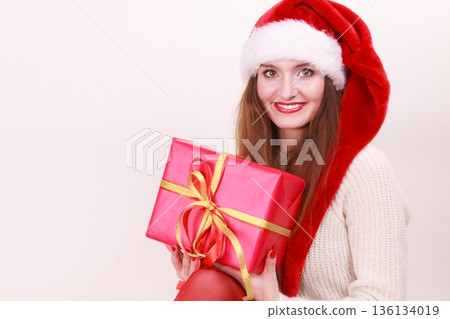Woman holding gift box. Christmas time Woman holding gift box. Christmas time 136134019