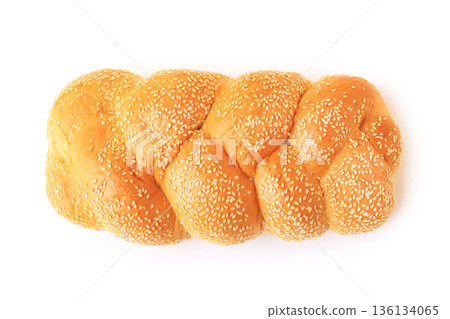 Top view of a fresh golden-brown braided loaf with sesame seeds on a white background. Ideal for bakery, culinary, religious holiday, and food industry marketing. High quality photo Top view of a fresh golden-brown braided loaf with sesame seeds on a white background. Ideal for bakery, culinary, religious holiday, and food industry marketing. High quality photo 136134065