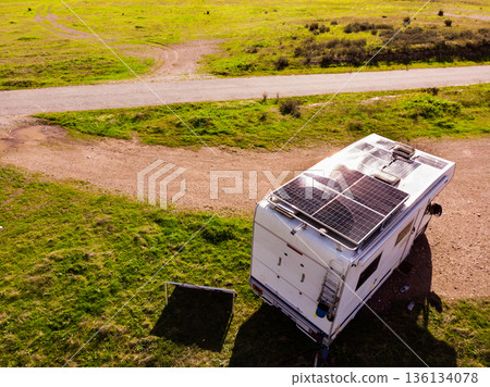 Caravan solar panels on roof camping on nature. Aerial view 136134078