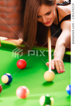 Young woman having fun with billiard. Young woman having fun with billiard. 136134214