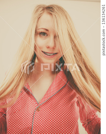 Portrait of attractive young woman wearing cute pajamas 136134261