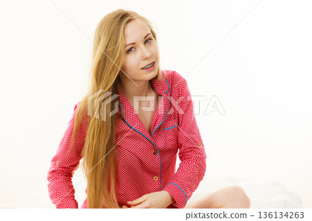 Portrait of attractive young woman wearing cute pajamas 136134263