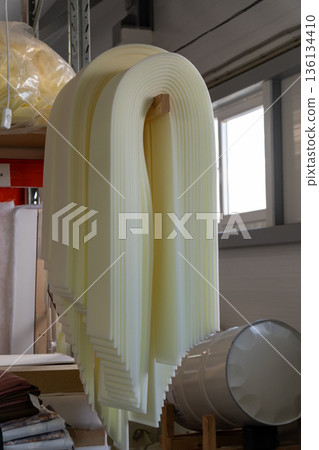 Layers of yellow foam create an abstract sculpture Layers of yellow foam create an abstract sculpture 136134410