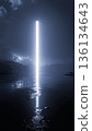 A pillar of light rising from the lake surface / A fantastic background material symbolizing the future and mystery 136134643