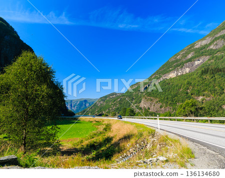 Tourism and travel. Mountains and road in Norway. 136134680