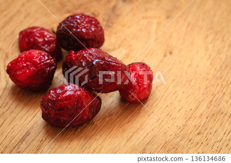 Dried cranberry fruit on wooden on table. Dried cranberry fruit on wooden on table. 136134686