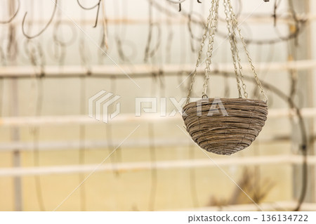 Wicker baskets hanging under ceiling 136134722