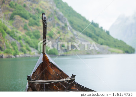 Old wooden viking boat in norwegian nature Old wooden viking boat in norwegian nature 136134725