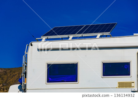 Caravan with tilt solar panel on roof. 136134932