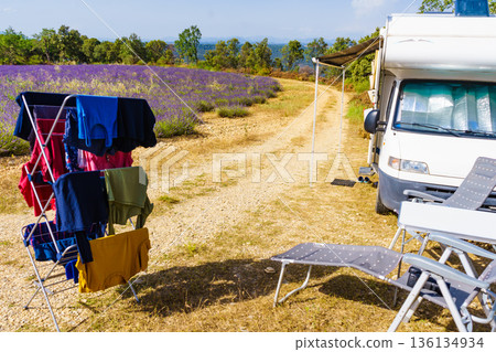 Clothes hanging to dry outdoors by camping car. Caravan vacation in France 136134934