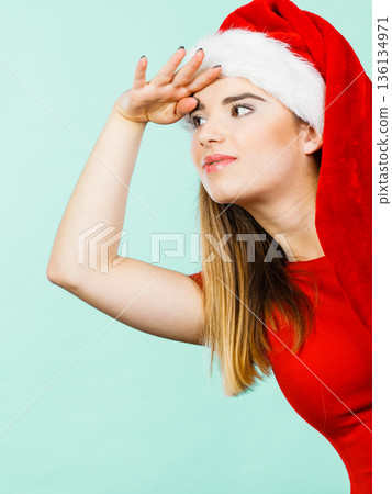 Woman wearing Santa Claus helper costume Woman wearing Santa Claus helper costume 136134971