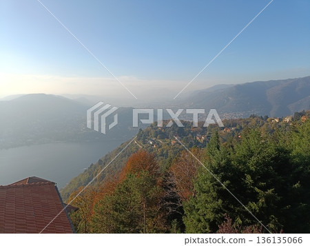 TREMEZZO, ITALY - Lake Como on a cloudy spring evening. TREMEZZO, ITALY - Lake Como on a cloudy spring evening. 136135066