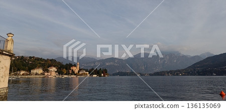 TREMEZZO, ITALY - Lake Como on a cloudy spring evening. TREMEZZO, ITALY - Lake Como on a cloudy spring evening. 136135069