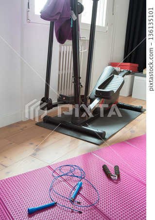 Training at home, with elliptical machine and yoga mat Training at home, with elliptical machine and yoga mat 136135101