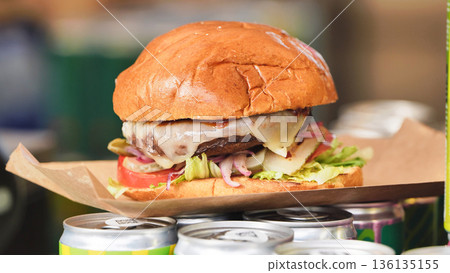 Cheeseburger with melted cheese, lettuce, and pickles 136135155
