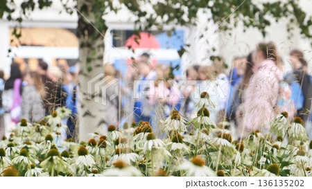 Students walking on campus street during summer 136135202