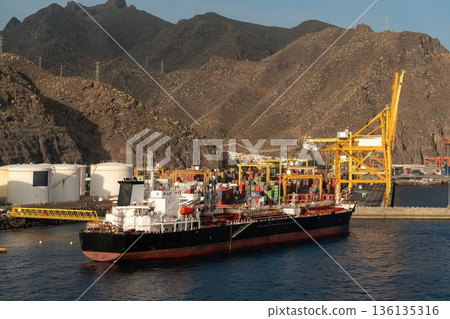Cargo ship at container terminal in Santa Cruz de Tenerife port, Spain Cargo ship at container terminal in Santa Cruz de Tenerife port, Spain 136135316