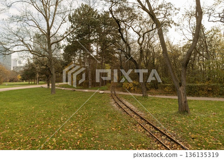 Donauparkbahn railway tracks curving through autumn Donaupark in Vienna Donauparkbahn railway tracks curving through autumn Donaupark in Vienna 136135319