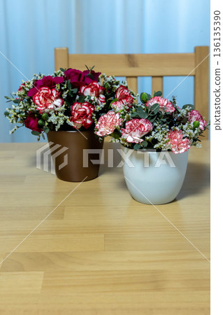 Colorful flower arrangement on the table Colorful flower arrangement on the table 136135390