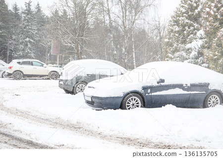 Snow Covered Parked Cars In Outdoor Parking Area During Winter Snow Covered Parked Cars In Outdoor Parking Area During Winter 136135705