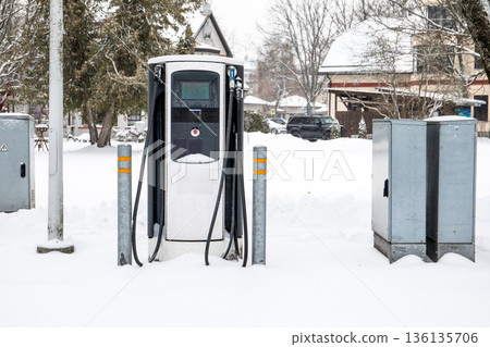 Electric Vehicle Charging Station On Snow Covered Residential Street Electric Vehicle Charging Station On Snow Covered Residential Street 136135706