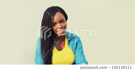 stylish young african woman with dreadlocks in the city stylish young african woman with dreadlocks in the city 136136511