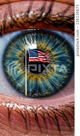 An extreme close-up of a human eye with a vibrant blue and gold iris, featuring a waving American flag reflected within the pupil, symbolizing patriotism and national identity. 136136673