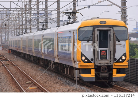 A long train of E257 series Wakashio express trains speeding along the Keiyo Line. Photo taken on June 20, 2010. A long train of E257 series Wakashio express trains speeding along the Keiyo Line. Photo taken on June 20, 2010. 136137214