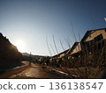 Residential area illuminated by the setting sun 136138547