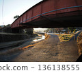 Railway bridge illuminated by the setting sun 136138555