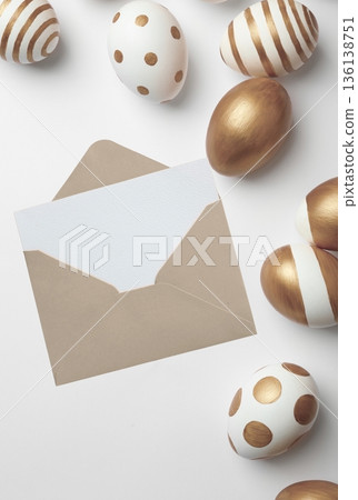 Easter greeting card with gold decorated eggs and envelope 136138751