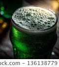 Green Beer in Pint Glass with Foam and Bubbles Close Up St Patrick's Day Bar Drink 136138779