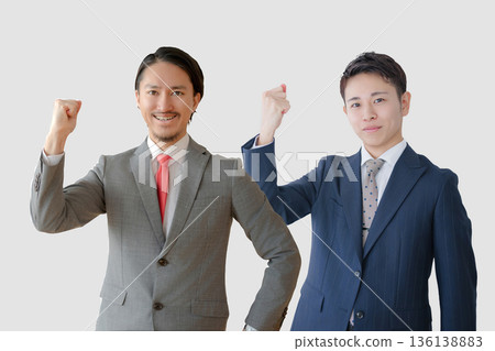 Businessmen pumping their fists Businessmen pumping their fists 136138883