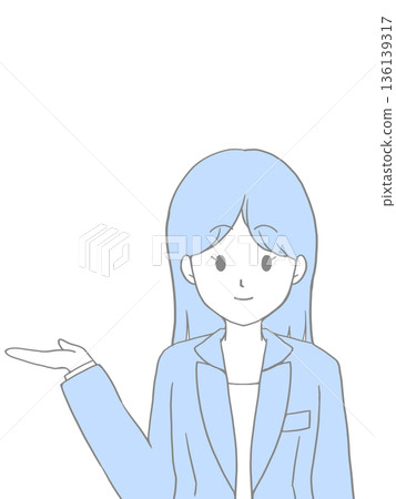 A woman with long hair in a suit giving directions with a smile 136139317