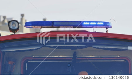 First responder vehicle with flashing blue lights signaling emergency and protection First responder vehicle with flashing blue lights signaling emergency and protection 136140026