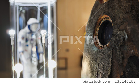 Soyuz descent module and spacesuit showing space exploration history 136140193