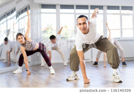 Group of young people dancing hip hop Group of young people dancing hip hop 136140309