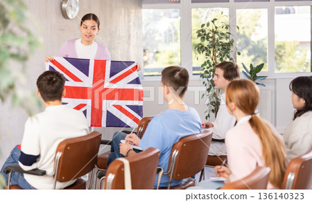 Female student telling coursemates about United Kingdom at lecture 136140323