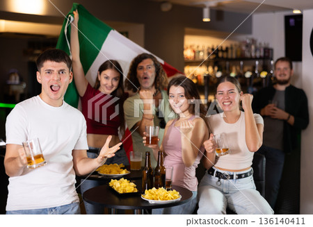Group of fans in bar with Italian flag Group of fans in bar with Italian flag 136140411