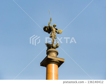 Saint George slaying dragon statue symbolizing victory, bravery, and legend Saint George slaying dragon statue symbolizing victory, bravery, and legend 136140412