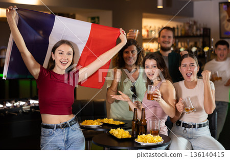 Group of fans in bar with French flag Group of fans in bar with French flag 136140415