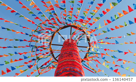Colorful flags and ribbons decorating a maypole in Moscow for a summer celebration 136140457