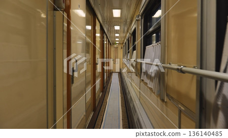 Train carriage corridor interior at night, long journey transportation and travel 136140485